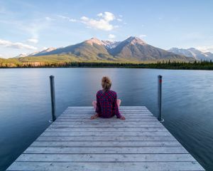 Preview wallpaper girl, alone, pier, water, mountains, view