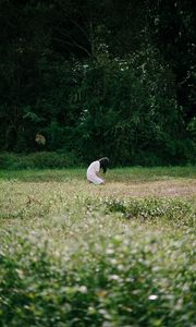 Preview wallpaper girl, alone, sad, field, trees, grass