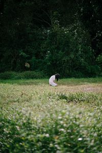 Preview wallpaper girl, alone, sad, field, trees, grass