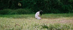 Preview wallpaper girl, alone, sad, field, trees, grass