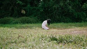 Preview wallpaper girl, alone, sad, field, trees, grass