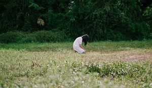 Preview wallpaper girl, alone, sad, field, trees, grass