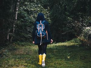 Preview wallpaper girl, backpack, forest, walk, fall