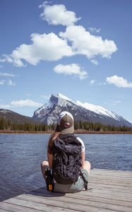 Preview wallpaper girl, backpack, pier, lake, mountain, travel