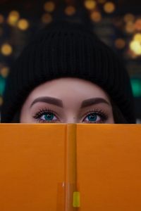 Preview wallpaper girl, book, glance, eyes, face