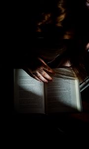 Preview wallpaper girl, book, reading, hand, dark