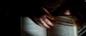 Preview wallpaper girl, book, reading, hand, dark