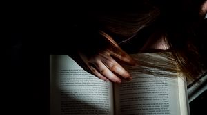 Preview wallpaper girl, book, reading, hand, dark