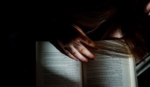 Preview wallpaper girl, book, reading, hand, dark