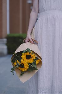 Preview wallpaper girl, bouquet, sunflowers, eucalyptus