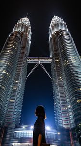 Preview wallpaper girl, building, skyscraper, night