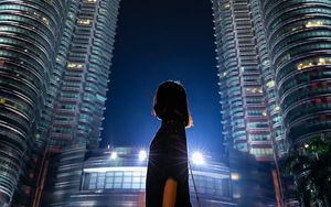 Preview wallpaper girl, building, skyscraper, night