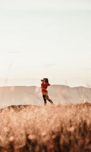 Preview wallpaper girl, camera, field, photographer