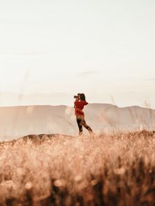 Preview wallpaper girl, camera, field, photographer