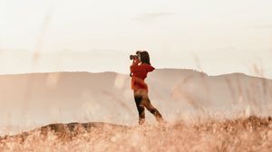 Preview wallpaper girl, camera, field, photographer