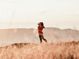 Preview wallpaper girl, camera, field, photographer