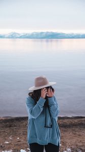 Preview wallpaper girl, camera, hat, photographer, nature