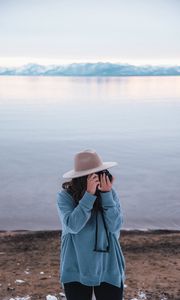 Preview wallpaper girl, camera, hat, photographer, nature