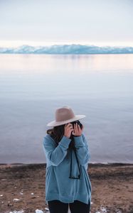 Preview wallpaper girl, camera, hat, photographer, nature