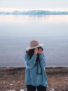 Preview wallpaper girl, camera, hat, photographer, nature