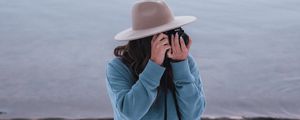 Preview wallpaper girl, camera, hat, photographer, nature