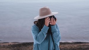 Preview wallpaper girl, camera, hat, photographer, nature