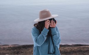 Preview wallpaper girl, camera, hat, photographer, nature
