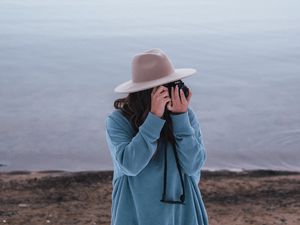 Preview wallpaper girl, camera, hat, photographer, nature