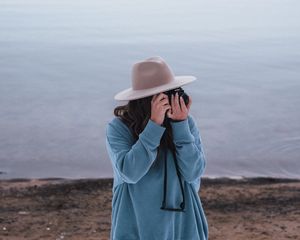 Preview wallpaper girl, camera, hat, photographer, nature