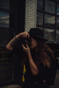 Preview wallpaper girl, camera, hat, photographer, tattoo