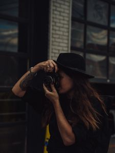 Preview wallpaper girl, camera, hat, photographer, tattoo