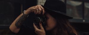 Preview wallpaper girl, camera, hat, photographer, tattoo