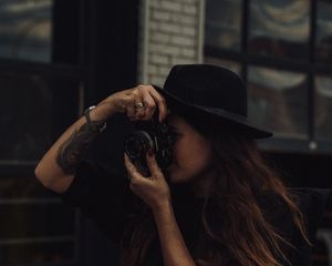 Preview wallpaper girl, camera, hat, photographer, tattoo