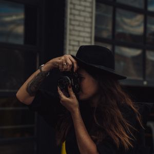 Preview wallpaper girl, camera, hat, photographer, tattoo