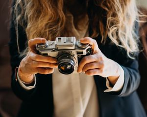 Preview wallpaper girl, camera, photographer, objective, hands