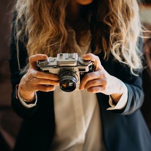 Preview wallpaper girl, camera, photographer, objective, hands