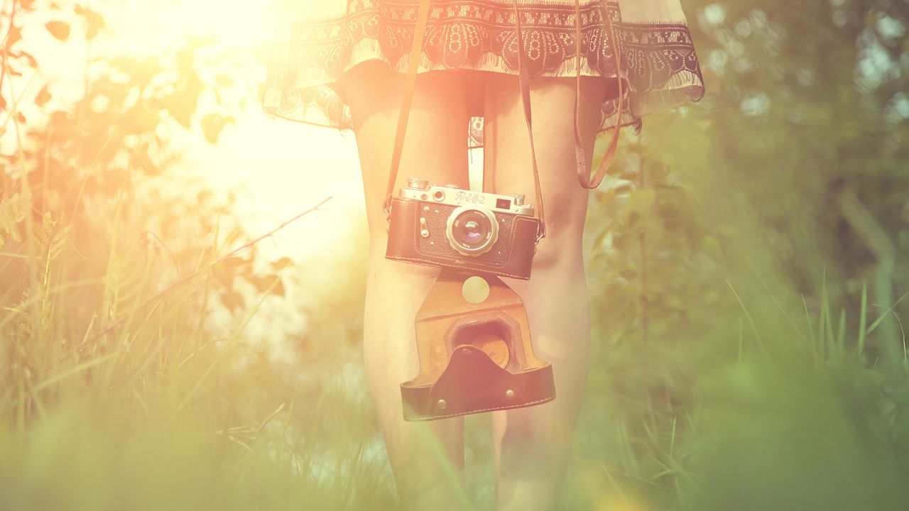 Wallpaper girl, camera, sun, grass, legs, dress, flare