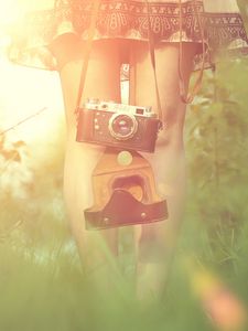 Preview wallpaper girl, camera, sun, grass, legs, dress, flare