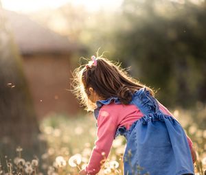 Preview wallpaper girl, child, dandelions, field