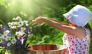 Preview wallpaper girl, child, flowers, bucket, water