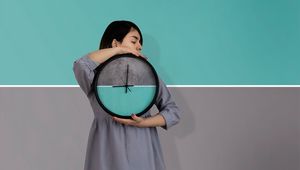 Preview wallpaper girl, clock, wall, symmetry, minimalism