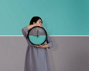 Preview wallpaper girl, clock, wall, symmetry, minimalism