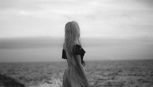 Preview wallpaper girl, coast, bw, waves, spray