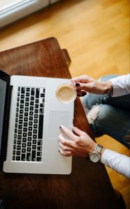 Preview wallpaper girl, coffee, cup, hands, laptop