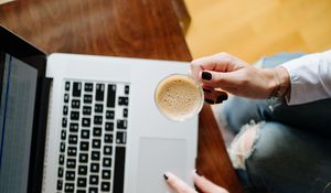 Preview wallpaper girl, coffee, cup, hands, laptop