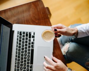 Preview wallpaper girl, coffee, cup, hands, laptop