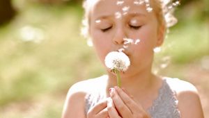 Preview wallpaper girl, face, dandelion, flower, stem