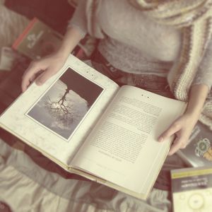Preview wallpaper girl, hand, books, mood, blurring