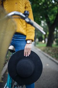 Preview wallpaper girl, hand, hat, bike