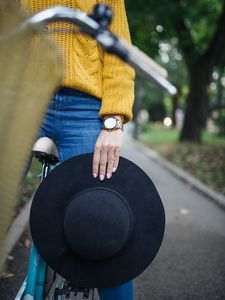 Preview wallpaper girl, hand, hat, bike